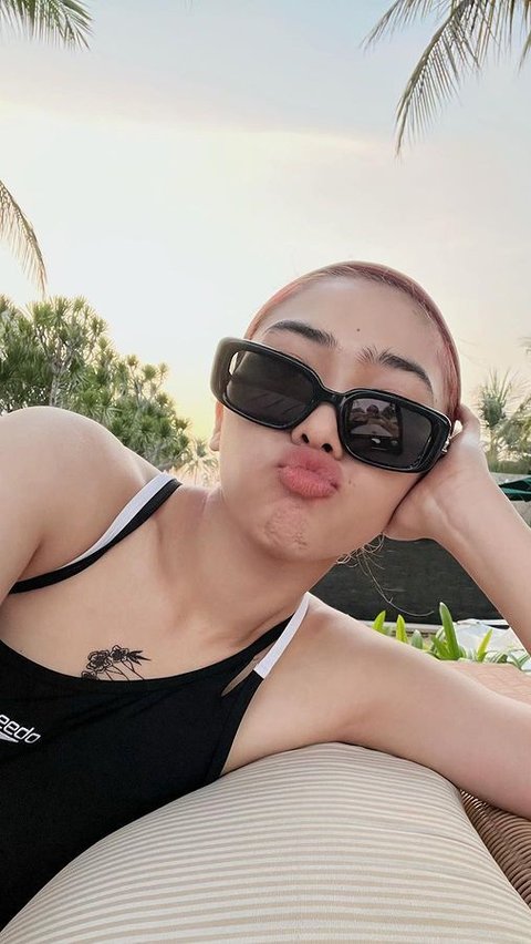 Portrait of Isyana Sarasvati Fearlessly Showing off Tattoo on Her Chest During Vacation