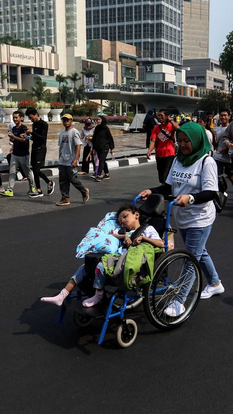 FOTO: Antusiasme Anak-Anak Pengidap Celebral Palsy Ikut Kampanye di Car Free Day