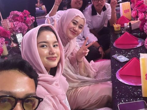 Portrait of Aaliyah Massaid Wearing Hijab at Aurel's Second Child's Aqiqah, Thariq Stares