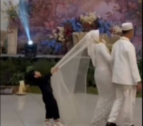 Making Nervous, Bride Nearly Falls Because of Naughty Child's Prank at Wedding