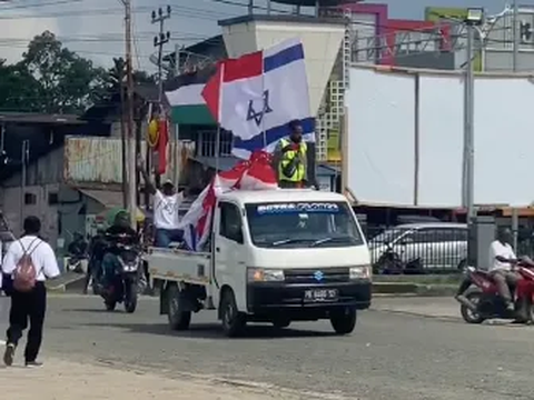 Viral Aksi Damai Warga Papua Kibarkan Bendera Palestina dan Israel, Netizen 'Kok Israel Ukurannya Lebih Gede'