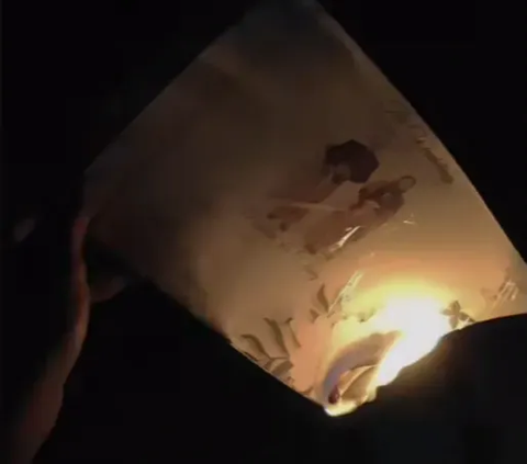 Sad Moment of a Woman Burning Wedding Invitations After Canceling the Marriage, Not Continuing because She Believes It Will Collapse