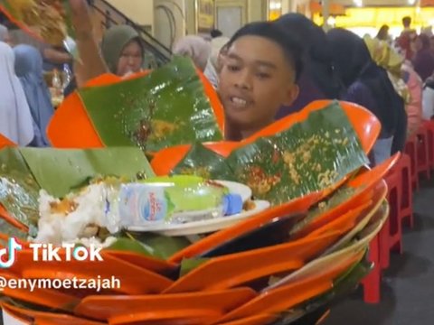 Skill Pelayan Angkat Piring Kotor Ini Bikin Satu Restoran Heboh, Bagai Akrobat