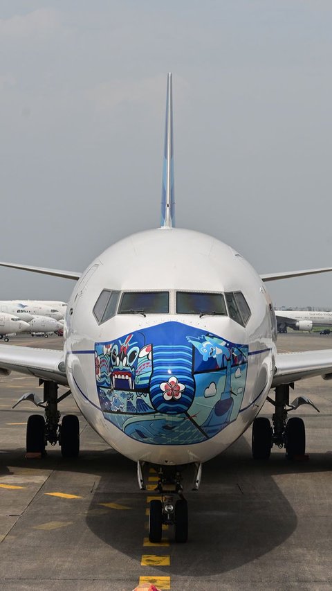 Asik! Penumpang Garuda Indonesia Boleh Lepas Masker