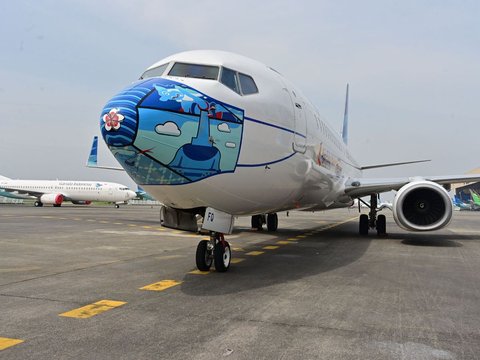 Asik! Penumpang Garuda Indonesia Boleh Lepas Masker