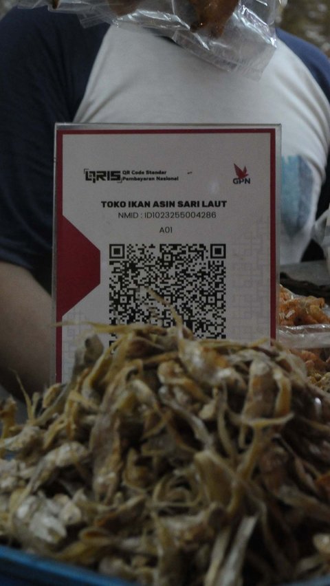 FOTO: Tak Lagi Gratis, Pelaku Usaha Mikro Kini Kena Tarif QRIS 0,3 Persen