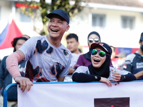 Romantis sampai Finish, Ini Momen Ganjar Dikawal Istri saat Lari Marathon di Yogya