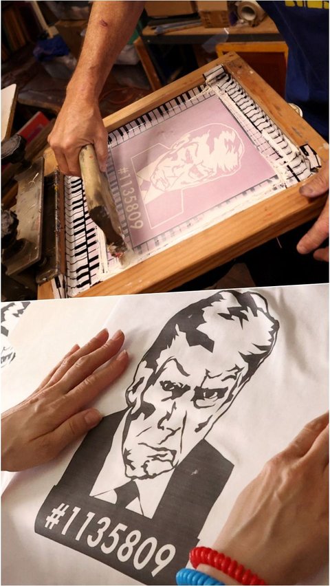 Pegawai toko melakukan pengepresan kaos bergambar mantan Presiden Donald Trump saat memproduksi di toko Y-Que.