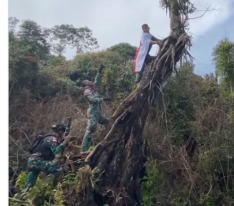 Dikawal Senjata Laras Panjang, Ini Detik-Detik Menegangkan Prajurit TNI Kibarkan Merah Putih