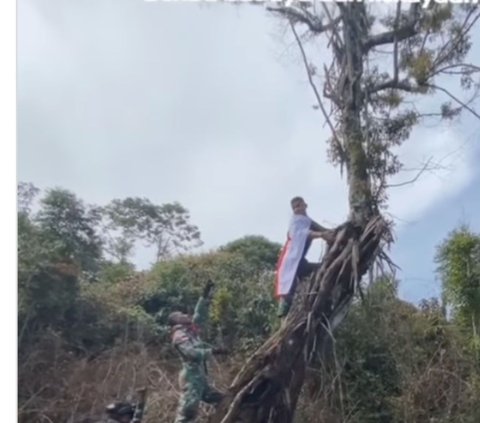 Dikawal Senjata Laras Panjang, Ini Detik-Detik Menegangkan Prajurit TNI Kibarkan Merah Putih