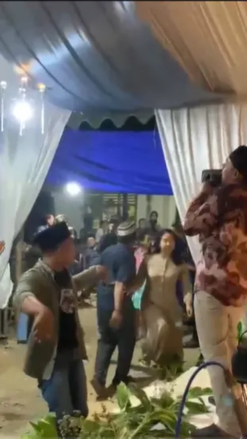 Having Fun Dancing with a Beautiful Singer, Husband Confronted by Wife and Child, Sandal Thrown on Stage