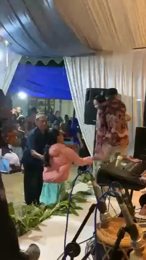 Having Fun Dancing with a Beautiful Singer, Husband Confronted by Wife and Child, Sandal Thrown on Stage