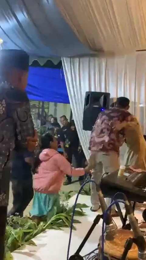 Having Fun Dancing with a Beautiful Singer, Husband Confronted by Wife and Child, Sandal Thrown on Stage