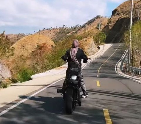 Portrait of Dara Arafah Looking Fierce Riding a Motorcycle Around Komodo Island