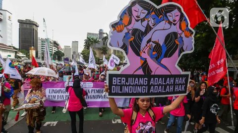 FOTO: Aksi Ribuan Aktivis Perempuan Unjuk Rasa Peringati Hari Perempuan Internasional