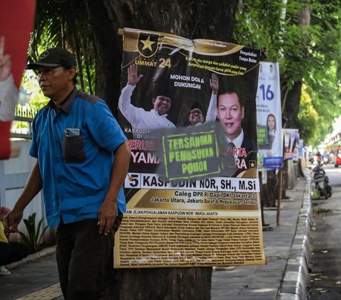 FOTO: Viral Poster-Poster Caleg Dilabeli 'Tersangka Penusukan Pohon', Ini Penampakannya