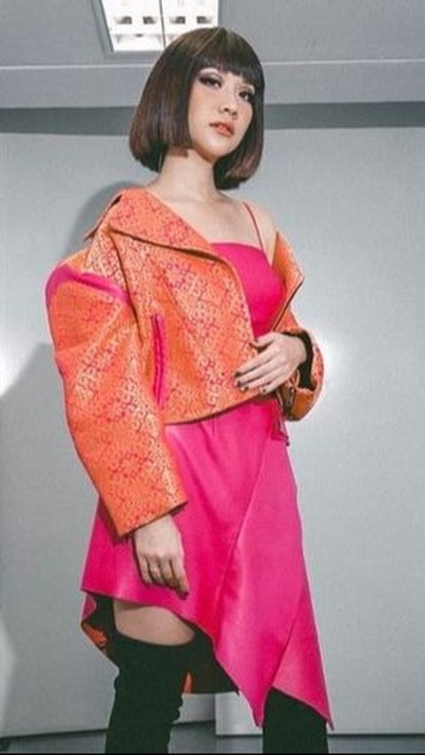 BCL with a custom pink songket jacket and a stunning leather dress.