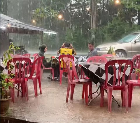 Make a game of who stands up first and treats, this gang stays wet even though it rains while hanging out in an open cafe