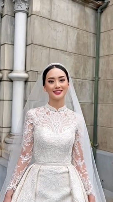 In the post, a bride can be seen wearing a white dress.