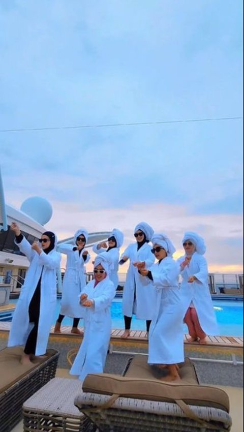 Portrait of Cut Meyriska Vacationing with Bestie on a Cruise Ship, Having Fun Dancing While Wearing Bathrobe