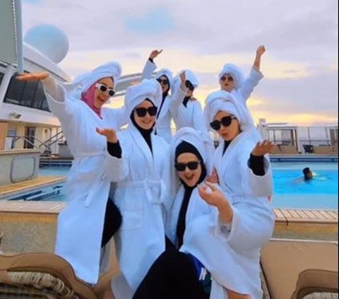 Portrait of Cut Meyriska Vacationing with Bestie on a Cruise Ship, Having Fun Dancing While Wearing Bathrobe
