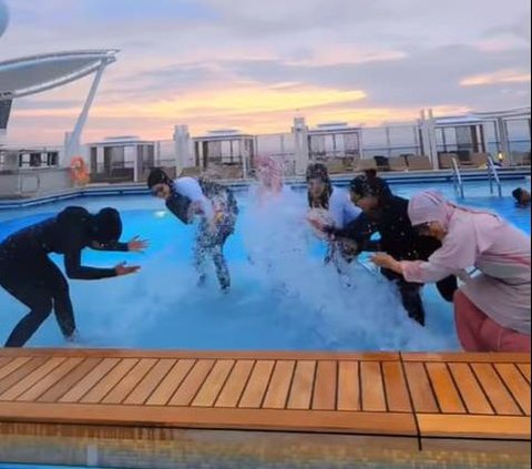 Portrait of Cut Meyriska Vacationing with Bestie on a Cruise Ship, Having Fun Dancing While Wearing Bathrobe