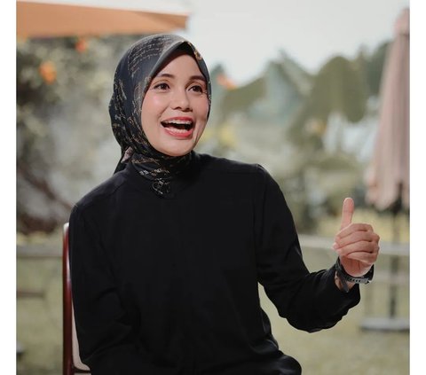 Portrait of Siti Atikoh Wearing Javanese Script Motif Hijab