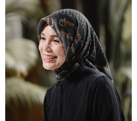 Portrait of Siti Atikoh Wearing Javanese Script Motif Hijab