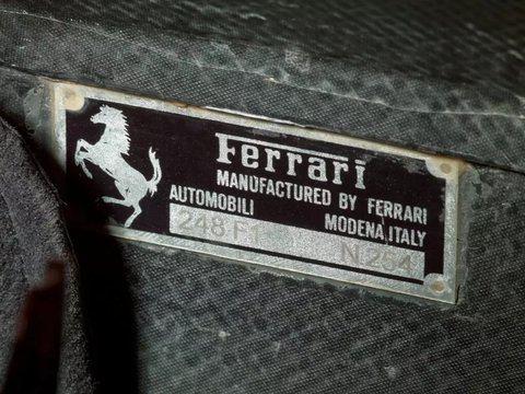 Plakat Ferrari 248 F1 milik mantan pembalap Michael Schumacher.