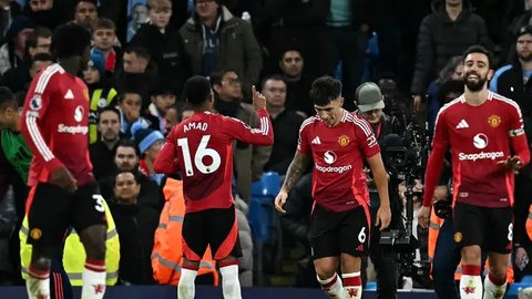 Bertandang ke markas Manchester City, Manchester United tampil cemerlang dan meraih kemenangan sensasional di laga pekan ke-16 Liga Inggris 2024/2025. (Paul ELLIS/AFP)