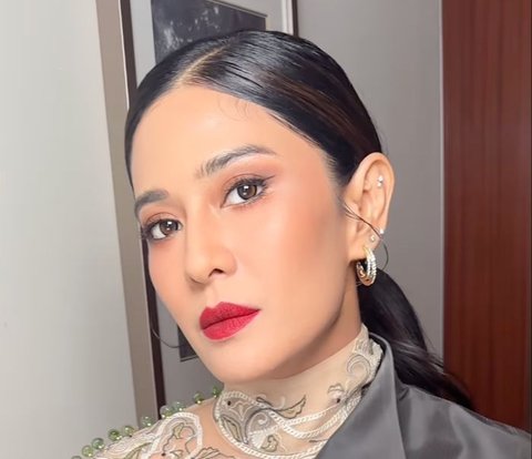 Portrait of Dian Sastro's Fierce Makeup with Bold Red Lipstick