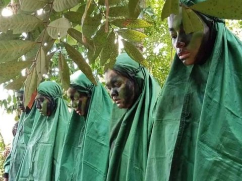 Portrait of Air Force Cadets Praying in the Middle of the Forest During Combat Training, Wearing Camouflage Uniform and Holding Weapons