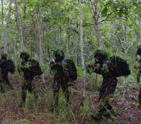 Portrait of Air Force Cadets Praying in the Middle of the Forest During Combat Training, Wearing Camouflage Uniform and Holding Weapons