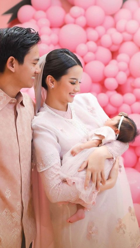 Portrait of Sabrina Anggraini, like a living Barbie, wearing a Pink Dress at her Daughter's Aqiqah Event.