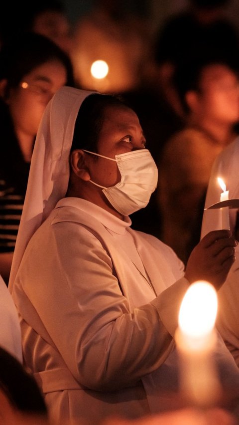 Tri Hari Suci merupakan tiga hari suci yang jatuh pada waktu Misa Kamis Putih, Jumat Agung, dan Sabtu Suci. Foto: Yasuyoshi CHIBA / AFP