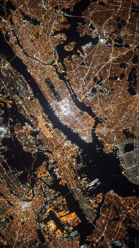 Even though it is nighttime, New York City in the United States appears very bright from outer space.