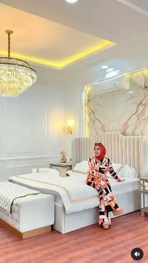 There is a beautiful marble wall behind the bed.