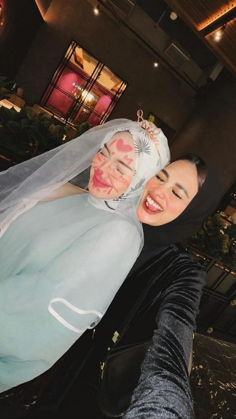 With a face full of lipstick scribbles and a veil crown, Melody Prima thoroughly enjoyed her second bridal shower moment.