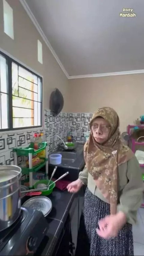 This family is seen cooking together.