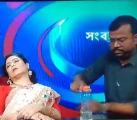 Heat Wave up to 46 Degrees, News Presenter Suddenly Faints During Live Broadcast Unable to Withstand the Heat