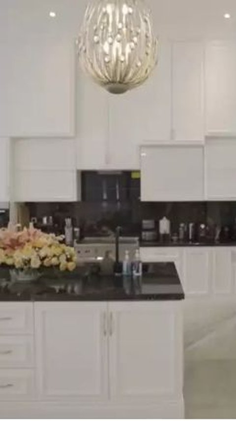 This is a picture of a clean kitchen in Eko's house. The kitchen is designed with a dominant white color.