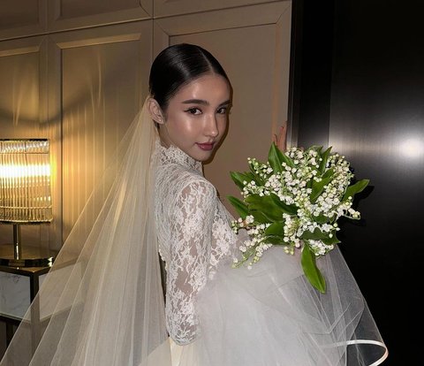 Portrait of Anggun Transgender Rinrada Yoshi in a Wedding Dress