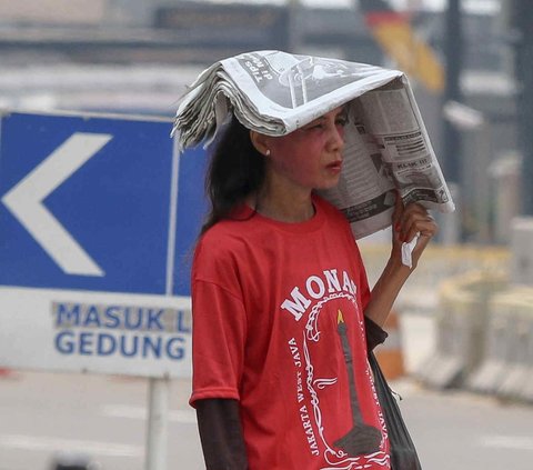 FOTO: Potret Jakarta Terpanggang Cuaca Panas, Suhu 33 Derajat Celcius tapi Terasa 39 Derajat