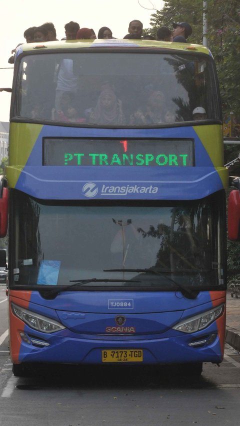 FOTO: Serunya Berkeliling Jakarta Naik Bus Wisata Atap Terbuka