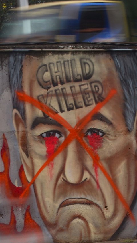 FOTO: Mural 'Stop Genocide' di Rafah Palestina dengan Wajah Benjamin Netanyahu Menghiasi Sudut Kota Jakarta