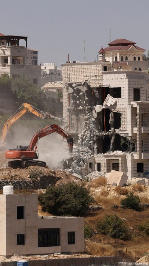 Kehadiran Netanyahu di AS pun menjadi sorotan, sementara di Hebron, tindakan penghancuran rumah warga Palestina menambah ketegangan dan kesengsaraan penduduk di wilayah tersebut. Foto: HAZEM BADER / AFP<br>