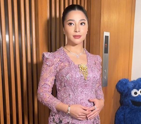 Portrait of Nikita Willy as a Bridesmaid, Striking a Flexible Pose Despite Being Pregnant