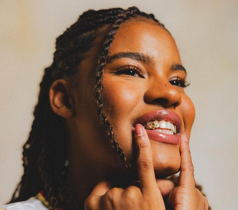 Basketball Player Nyara Sabally Showcases 14K Gold Olympic-Themed Grillz