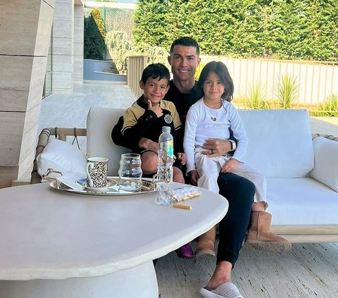 Portrait of Cristiano Ronaldo Taking Care of His Child, Often Spending Quality Time at the Beach
