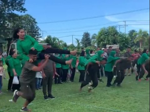 Not Carried, Husband's Action of Carrying Wife During This Running Competition Makes Netizens Laugh